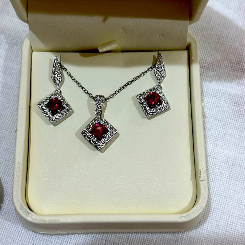 Sterling Silver Ruby Pendant Necklace, Earrings, and Ring set.